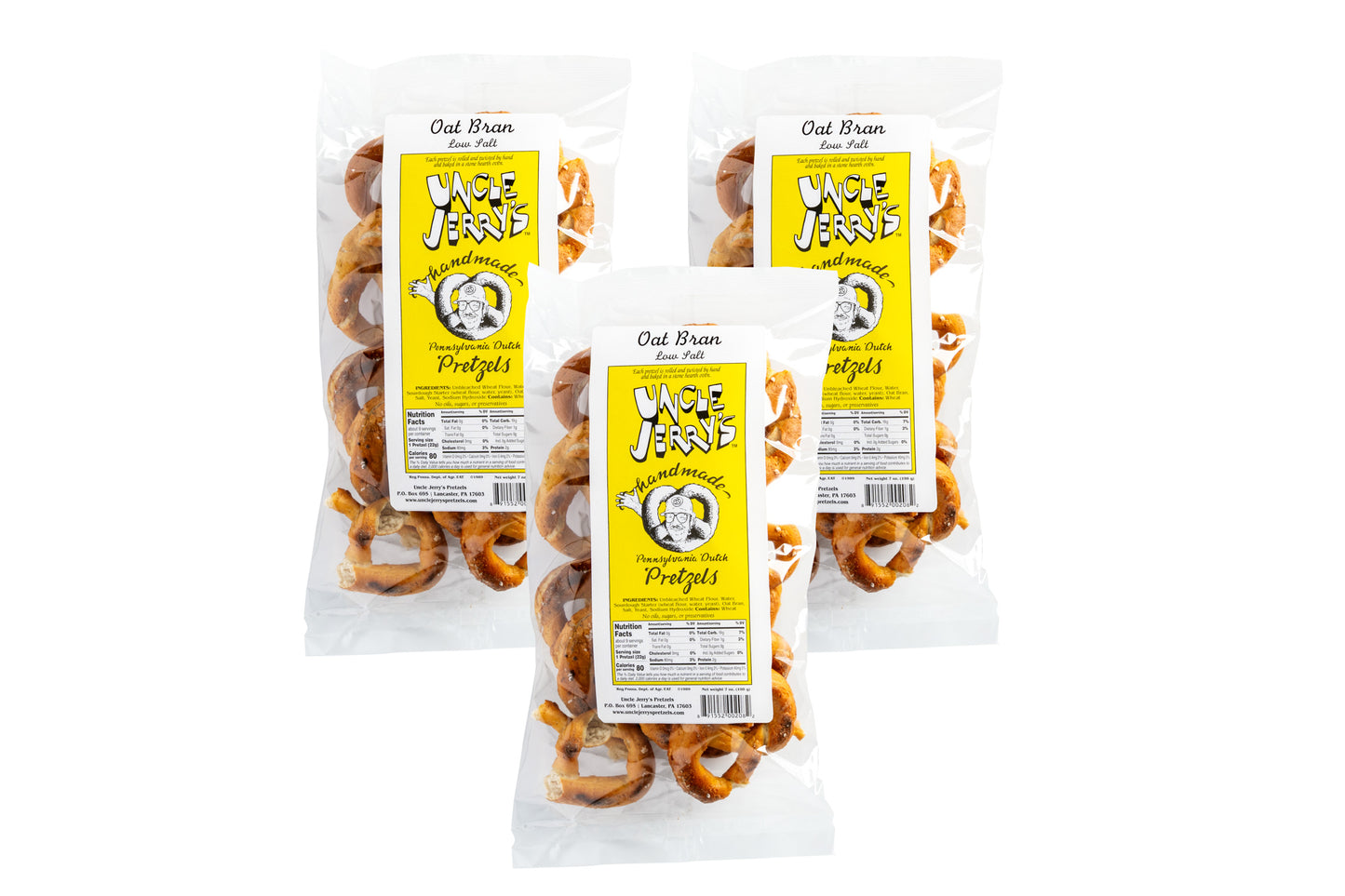 Three individually packaged oat bran pretzels with yellow labels